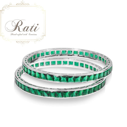 green oval channel set bangle with cubic zirconia